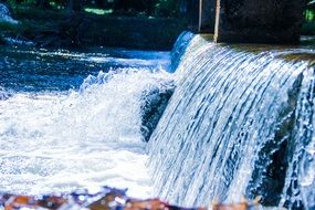 waterfall on the lake on a sunny day