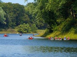 canoe on the river with green trees on the shore