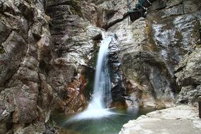 waterfall on a high rock in nature