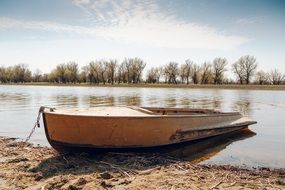 fishing boat on a pond on a sunny day