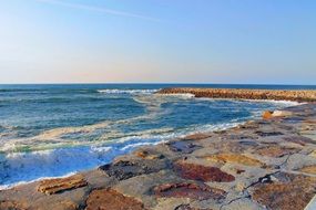 stone breakwater on a beach in Portugal