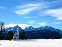 church against the backdrop of snow mountains in Germany