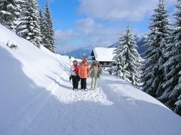 women walk along the trail in the snow , Zaferna-Hutte