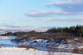 Beautiful snowy landscape with the clouds