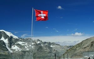 swiss flag in the mountains