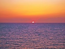 purple sea at a colorful sunset