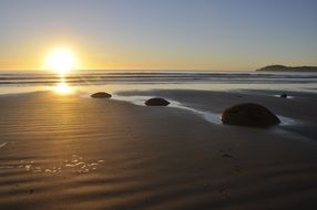 moeraki boulders on the beach in new zealand