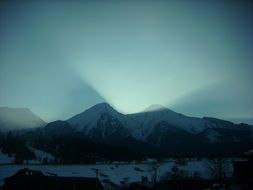 light behind the mountains in winter