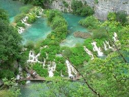 top view of tourists on boardwalk in National Park, croatia