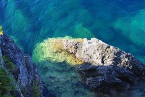 stone in the blue ocean