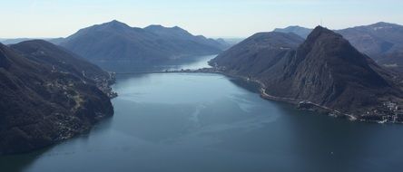 panorama of a large lake in the mountains of switzerland