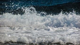 spraying sea waves with white foam