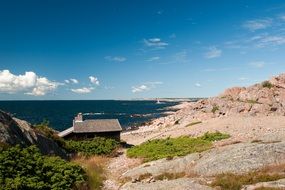 Summer landscape with house on rocky coastline at deep blue Sea, finland, Ã¥land