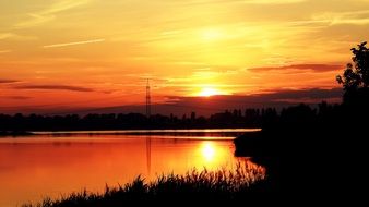 golden sunset over the city lake