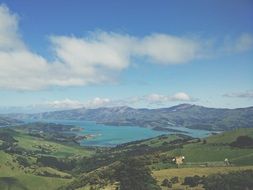 photo of a reservoir in a green valley
