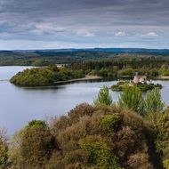 gothic Castle on small island in wilderness, Ireland