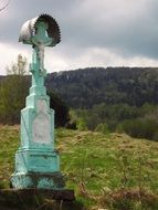 cross as a sculpture in the mountains of poland