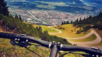 bicycle handlebar in view of beautiful mountain landscape, Mountain Biking