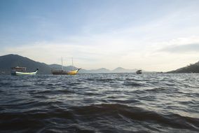 boats on Sea in view of mountains at coastline, Brasil, florianopolis