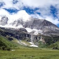 green valley between high mountains
