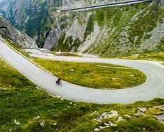 cyclist on a mountain winding road in the alps
