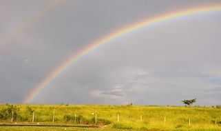 Beautiful double Rainbow above meadow, Brazil