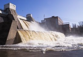 foamy waterflow streaming through Dam of Power Plant