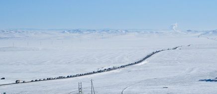 distant view of a highway among snowy mongolia