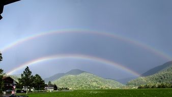 double rainbow after rain over countryside in germany