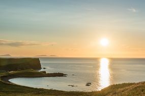 Panorama of the beautiful and colorful romantic sunset on the coast in Trumpan, Waternish in Scotland