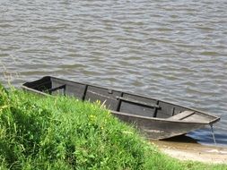 Boat on the shore in the summer