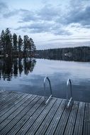 landscape of wooden flooring near a lake in finland