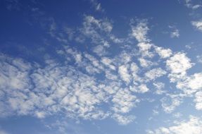 blue sky with weightless clouds