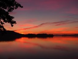 red sky after sunset on the lake