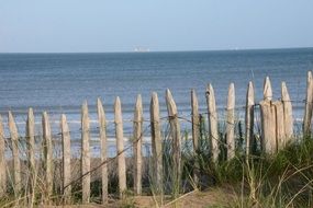 wooden fence as protection on the seashore