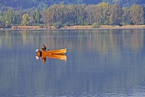 wooden boat on lake constance on a sunny day