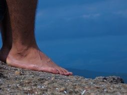 closeup photo of stand barefoot on a stone in Atibaya