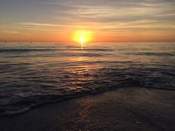 distant view of the bright sunset over the ocean