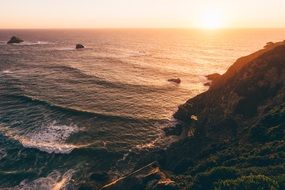 Sunset on the ocean and the cliffs