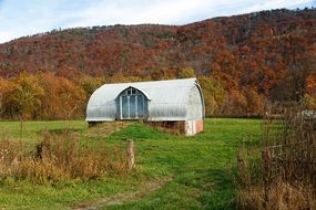 barn among the hills in the fall
