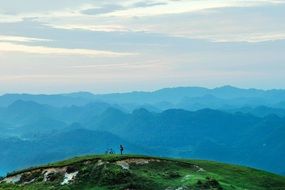 distant view of cyclists in the picturesque mountains