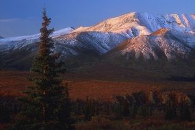 picturesque mountains in the snow in the sunset light