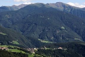 distant view of a village in a valley in the tyrol mountains