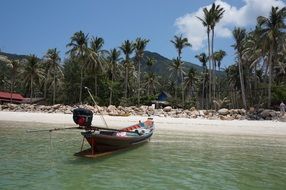 boat on the sandy beach in thailand