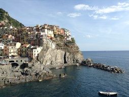 Beautiful buildings on the rocks on the shore in Italy