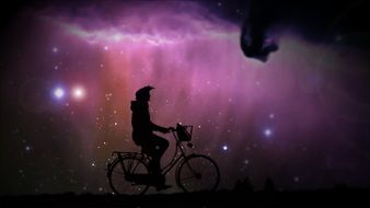 cyclist on a background of purple starry sky