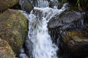 Waterfall in the rocks on the landscape