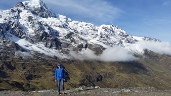 man in a blue jacket in the andes in peru