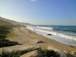 panorama of a sunny beach in tayrona national park in colombia