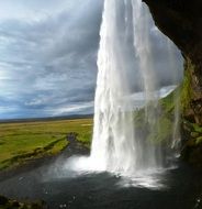 waterfall in iceland as a stream of water
